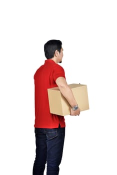 Young asian courier man carrying the box standing isolated over white background