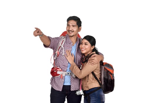 Romantic asian couple tourist looking at view and pointing with finger isolated over white background