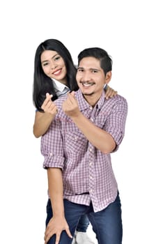 Portrait of asian man carrying the woman on his back with money gesture posing isolated over white background