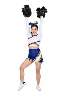 Beautiful asian cheerleader with hands in the air with pom-poms posing isolated over white background