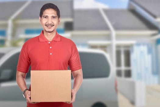 Young asian delivery man deliver the parcel to home