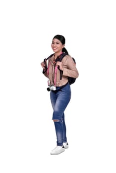 Portrait of asian traveler woman with camera and backpack standing isolated over white background