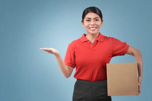 Happy asian female courier holding package over bright background