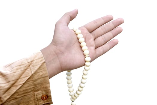 Muslim man holding prayer beads isolated over white background
