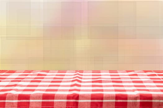 Empty table with red checkered tablecloth and bright bokeh background. For your food and product display montage.