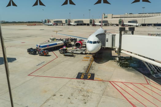 PALMA DE MALLORCA, BALEARIAN, SPAIN - JUNE 06, 2016: Airport of Mallorca, airplane in departure area during loading and refueling ready for departure.
