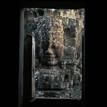 Stone Faces at the Bayon Temple the Tempel Ruins of Angkor Thom in the Temple City of Angkor near the City of Siem Reap in the west of Cambodia.  Cambodia, Siem Reap, April 2014