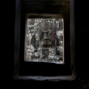 Stone Faces at the Bayon Temple the Tempel Ruins of Angkor Thom in the Temple City of Angkor near the City of Siem Reap in the west of Cambodia.  Cambodia, Siem Reap, April 2014