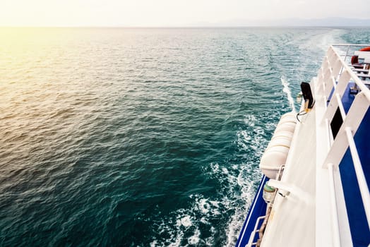 Travel boat sailing on the ocean during sunset in Thailand
