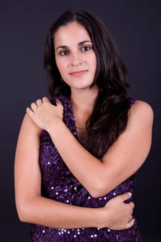 young beautiful brunette portrait against black background