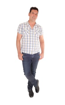 A tall handsome man standing in jeans and a checkered shirt with his.thumbs in his pocket, isolated for white background.