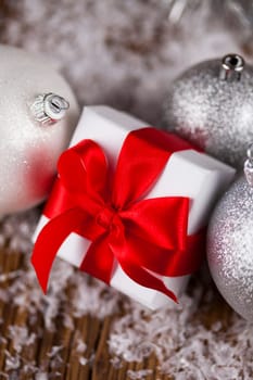 Balls, Gift box with red ribbon, Holiday background