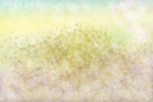 Abstract gold yellow bright bokeh background texture.