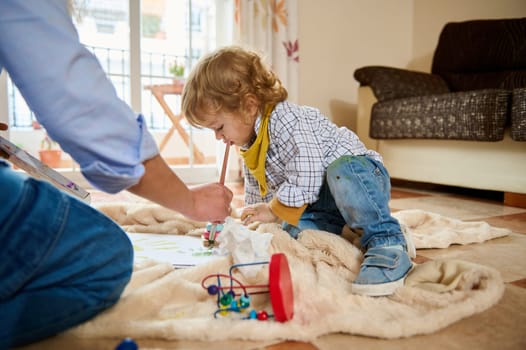 A joyful moment of a mother and child enjoying creative activities at home, fostering emotional connection and celebrating parenting.