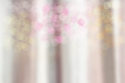 Blurred curtain with colorful bokeh as abstract background.
