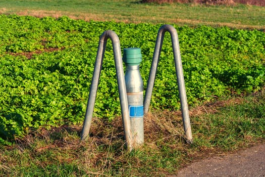 Ground water collection site on a field. Pipe with cover for checking groundwater.