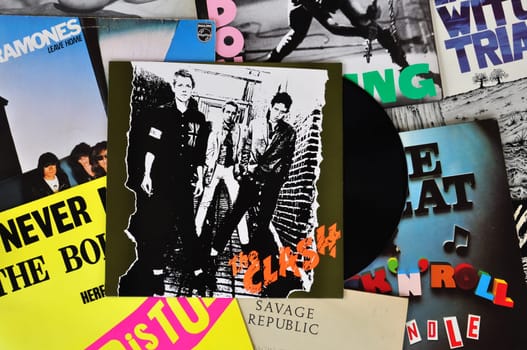 ATHENS, GREECE - MARCH 6, 2014: Vinyl records of punk rock bands and the debut album by The Clash released in 1977. Vintage LP album sleeves from the late 1970s and early 1980s.