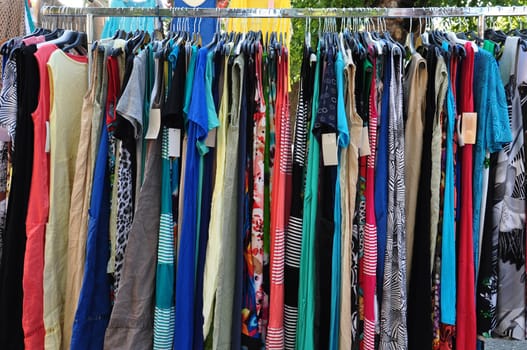 Clothes for sale at street market. Women's fashion.