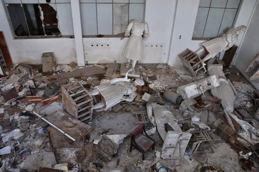 ATHENS, GREECE - JANUARY 15, 2013: Broken vandalized statues lay in ruins at the abandoned studio of sculptor Nikolas Pavlopoulos (1909 - 1990).