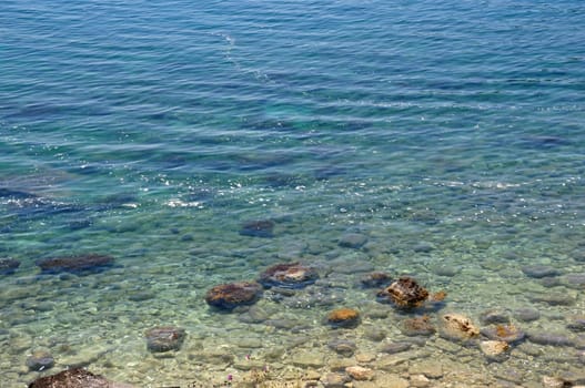 Dirt floating on sea surface. Polluted beach environmental issues.