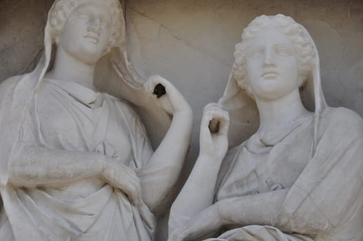 Stele of Demetria and Pamphile funerary sculpture in memory of two sisters depicted gazing apathetically and grasping their veils. Ancient cemetery of Kerameikos, Athens Greece.