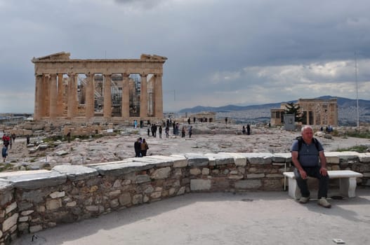 ATHENS, GREECE - MAY 6, 2014: View of Parthenon and visitors at the Acropolis of Athens, Greece.