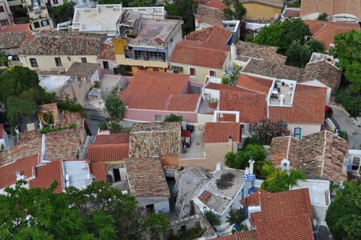 Panoramic view of the traditional Anafiotika neighborhood a maze of narrow streets and small houses built under the Acropolis by migrants from the Cycladic island of Anafi. Village style architecture in the city of Athens, Greece.