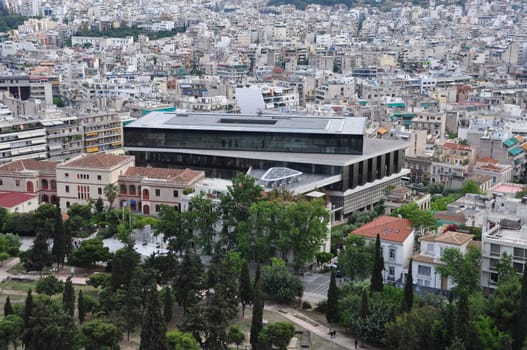 ATHENS, GREECE - MAY 6, 2014: Acropolis museum and panoramic view of downtown Athens, Greece.