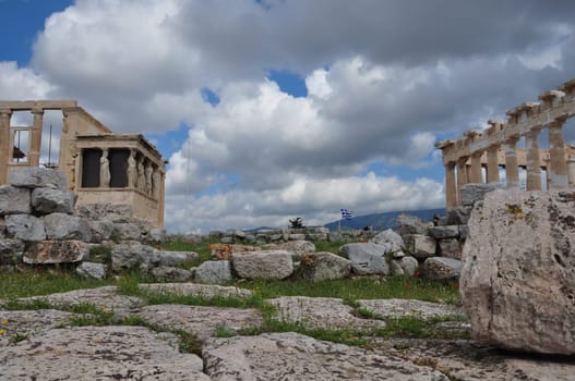 ATHENS, GREECE - MAY 6, 2014: View of Parthenon and Erechtheion with the Porch of Caryatids at the Acropolis of Athens, Greece.