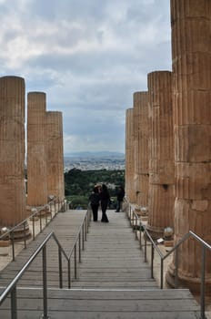 ATHENS, GREECE - MAY 6, 2014: Propylea of Acropolis and distant view of the city of Athens, Greece.