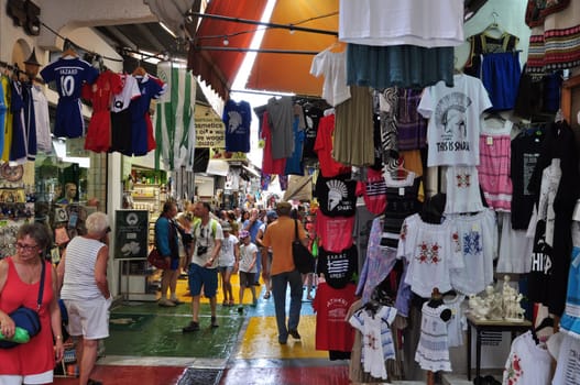 ATHENS, GREECE - SEPTEMBER 2, 2014: People shopping at Monastiraki flea market gift shops in Plaka, Athens Greece.