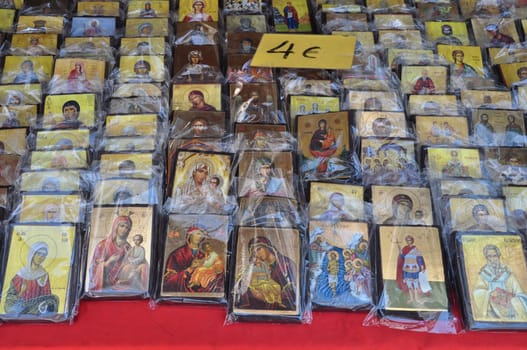 ATHENS, GREECE - AUGUST 15, 2014: Greek orthodox christian icons religious art for sale at street market.