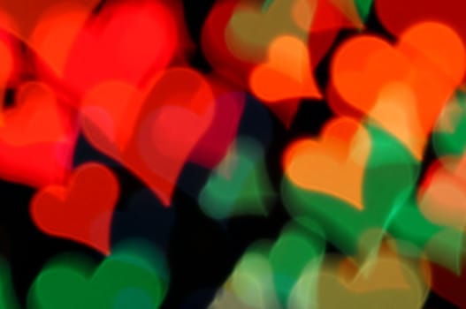 Colorful hearts abstract blur at night. Valentine's day happy background.