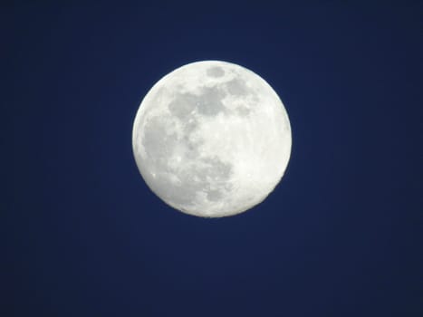 Amazing full moon over the city of Genova in winter days