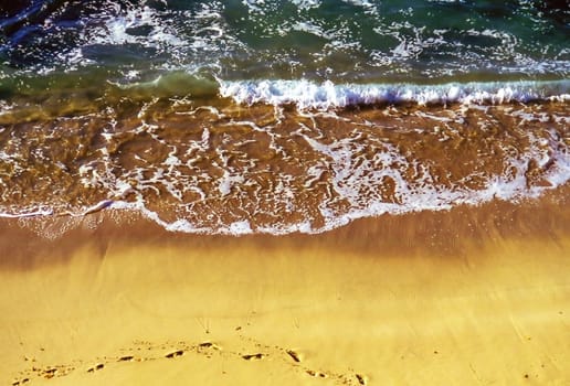 Sandy beach with foot prints in California