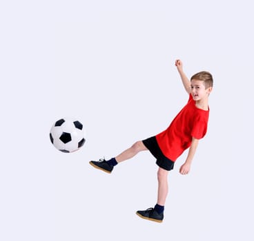 boy in red shirt with soccer ball in front of white background