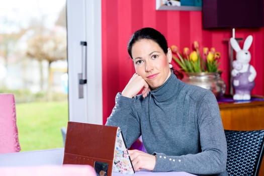 young woman at home using tablet pc