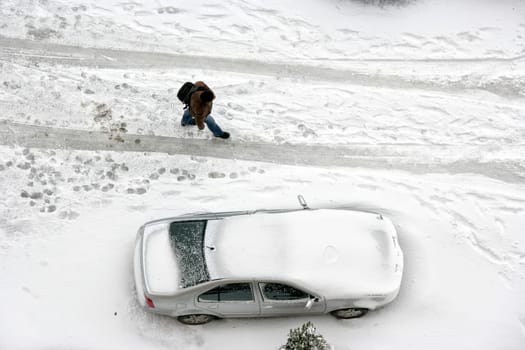 elevated view of parked car covered with snow