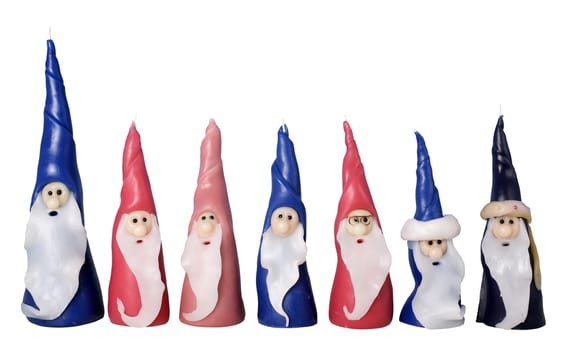an image of Santa Clause candles in a row on Christmas time.