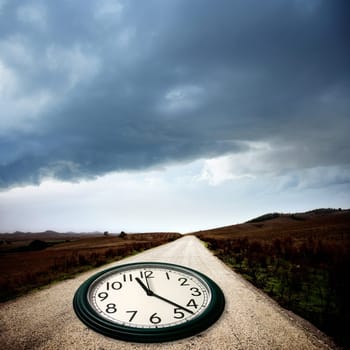 conceptual image of a clock on the dirt road