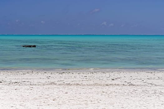 Turquoise water and sand beach at island Zanzibar