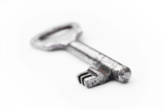 Old vintage key isolated on white background - new house key