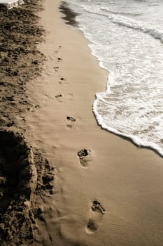 close upfootprints on beach