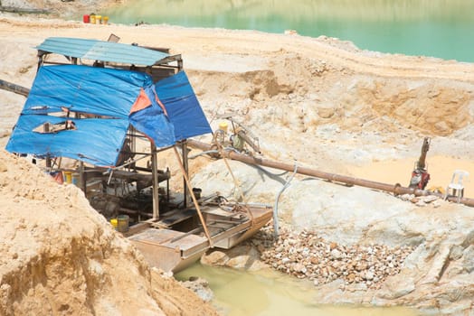 Dredge ship on the water. Sand quarry in south east Asia.