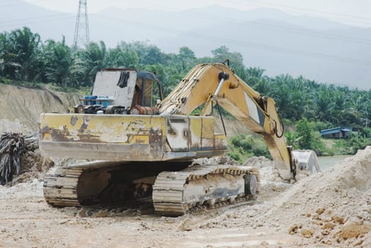 Excavator at sand quarry.