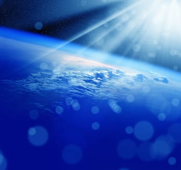Conceptual image of globe and sunrise. Furnished NASA image used for this image.