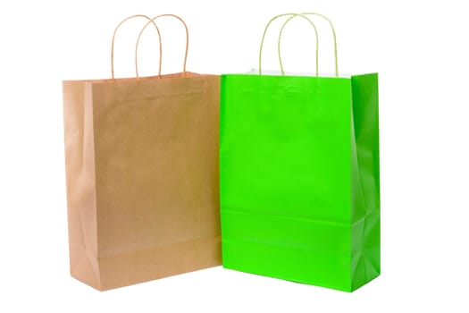 Variety of colored paper shopping bags on white background. Empty area.