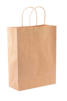 Brown paper shopping bag on white background. Empty area.