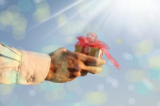 close up shot of a man holding gift box