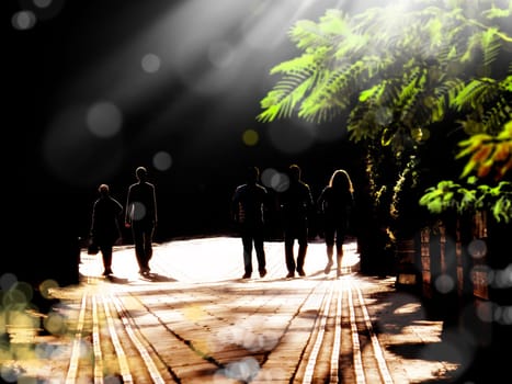 silhouetted people walking on street and sunbeam